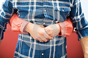 Close Up Of Woman Demonstrating Heimlich Maneuver In First Aid C