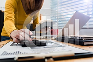 Close up woman doing finance at home office.