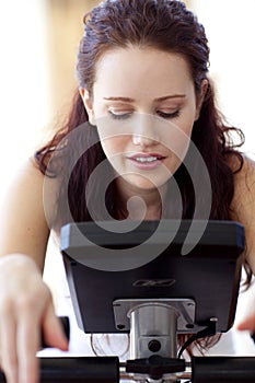 Close-up of woman doing spinning at home
