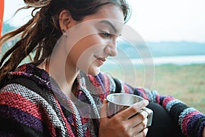Close up a woman drink a cup of coffee after wake up