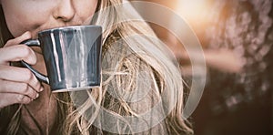 Close up of woman drinking coffee in cafe