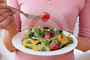 Close Up Of Woman Eating Healthy Salad