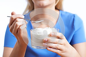 Close Up Of Woman Eating Natural Yogurt