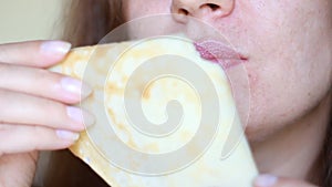 Close up woman eating pancakes for breakfast. Food and diet.
