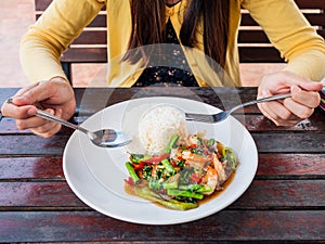 Close up woman eating in restaurant.