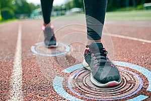 Close up of woman feet running on track