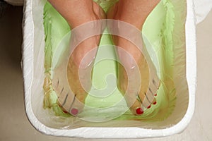 Woman feet in spa bowl photo