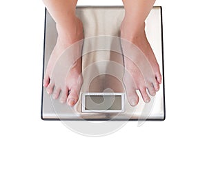 close-up of woman feet weighing scale isolated on white background.