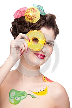 Close up of woman with fruit bodyart and pineapp