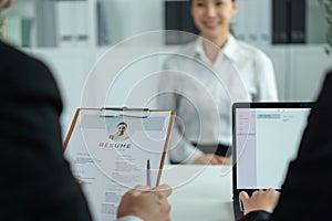 Close up of woman give resume to hr manager for job interview in office. Female sit on table and discuss with human resources