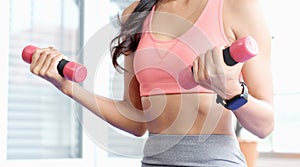 Close up of  woman hand holding dumbbell for exercise at home, Female lifting sport equipment for weight training, People wellness