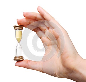 Close up of woman hand holding hourglass