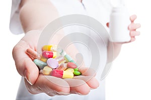 Close up with woman hand holding pills