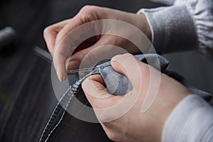 Close up of woman hand sewing