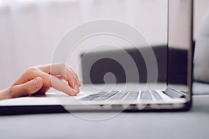 Close up of woman hand typing on laptop computer keyboard and surfing internet, online, working, business and technology, internet