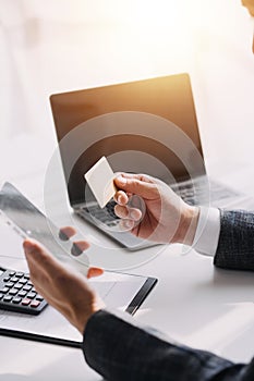 Close up of woman hand using credit card and laptop for payment and online shopping, Online shopping, payments digital banking, E-