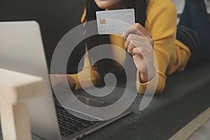 Close up of woman hand using credit card and laptop for payment and online shopping, Online shopping, payments digital banking, E-