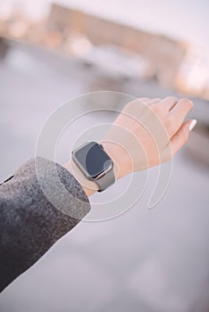 Close-up of woman hand, wearing in smart watch