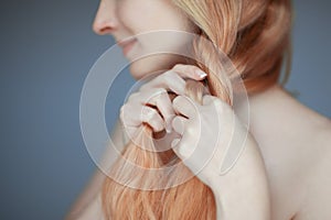 Close up woman hands braiding hair, sensual look