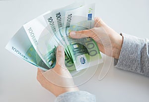 Close up of woman hands counting euro money