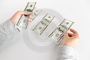 Close up of woman hands counting us dollar money