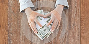 Close up of woman hands counting us dollar money