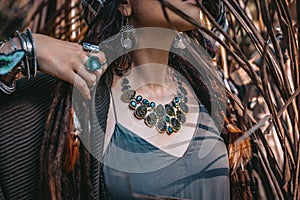 Close up of woman hands with with gem stones accessories outdoors