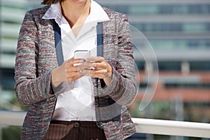 Close up woman hands holding mobile phone