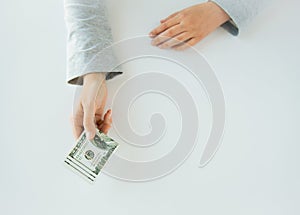 Close up of woman hands holding us dollar money