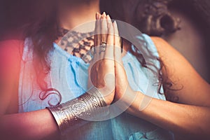 Close up of woman hands in namaste gesture photo