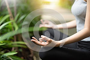 Close up woman hands practicing yoga and meditation.