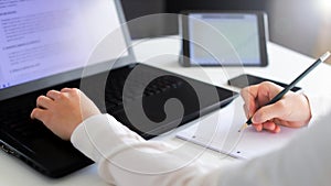 Close up of a woman hands typing on a keyboard. Distance learning, education online. Online working from home, business