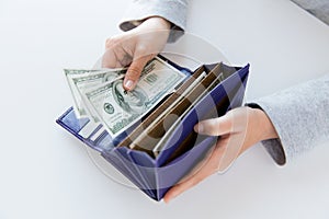 Close up of woman hands with wallet and money