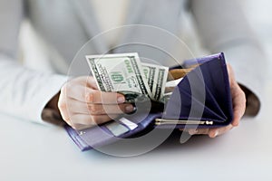 Close up of woman hands with wallet and money