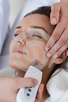 Close-up of woman having cavitation peeling photo