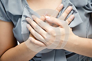 Close up woman having chest pain breast pain