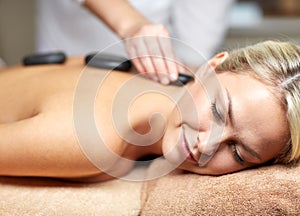 Close up of woman having hot stone massage in spa