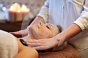 Close up of woman having hot stone massage in spa