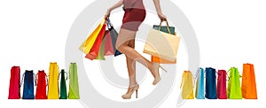Close up of woman on high heels with shopping bags