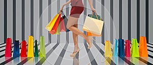 Close up of woman on high heels with shopping bags