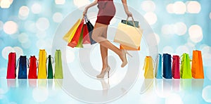 Close up of woman on high heels with shopping bags