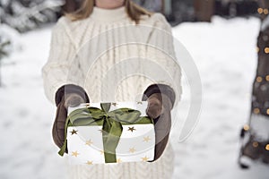Close up of woman holding Christmas present
