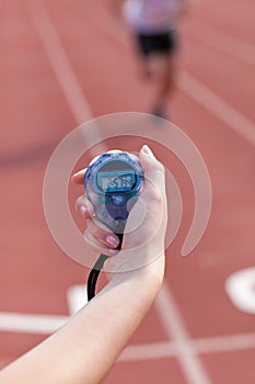 Close-up of a woman holding a chronometer