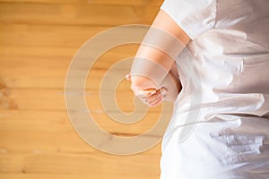 Close up woman holding her elbow symptomatic Office Syndrome