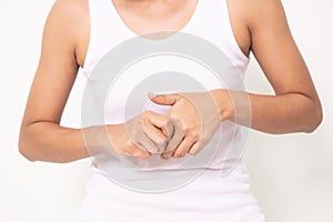 Close up woman holding her wrist symptomatic Office Syndrome on white background