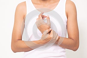 Close up woman holding her wrist symptomatic Office Syndrome on white background