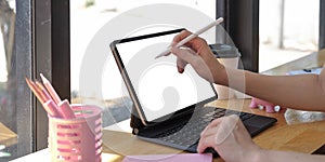 Close up of Woman holding new version digital tablet device in hands with smart pencil