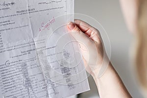 Close up of a woman holding a pregnancy check-up application document for blood sugar test