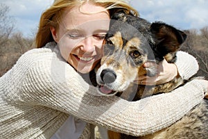 Close up of Woman Hugging German Shepherd Dog