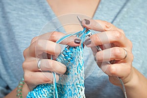 Close-up woman knitting